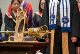 The ceremonial Eagle Feather and U of T's ceremonial mace at a 2023 convocation ceremony. The Eagle Feather was gifted to the Office of the President by Elders at the 2017 entrustment ceremony for the University of Toronto Truth and Reconciliation Steering Committee’s Report, “Answering the Call: Wecheehetowin” (photo by Lisa Sakulensky)